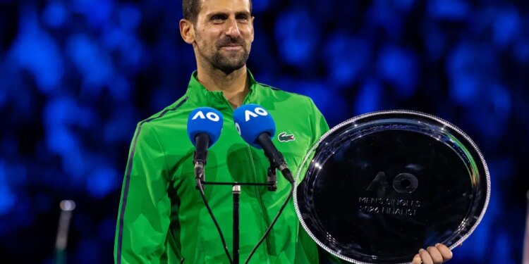 Novak Djokovic of Serbia with his finalist trophy after the final of the mens singles against Carlos Alcaraz of Spain at the Australian Open at Rod Laver Arena in Melbourne Park.
