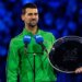 Novak Djokovic of Serbia with his finalist trophy after the final of the mens singles against Carlos Alcaraz of Spain at the Australian Open at Rod Laver Arena in Melbourne Park.