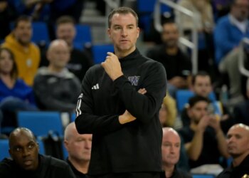Washington men's basketball coach Mike Hopkins on the sideline.