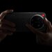 Xiaomi 17 Ultra Leica Edition with a hand ready to twist the manual camera zoom