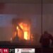 A popcorn machine ablaze during a Georgia-Oklahoma men's basketball game, with game stats shown on the left.