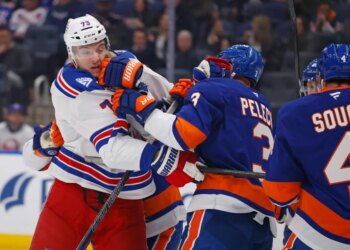 New York Rangers center Matt Rempe (73) and New York Islanders defenseman Adam Pelech (3) fight during the second period when the New York Islanders played the New York Rangers Wednesday, January 28, 2026 at UBS Arena in Elmont, NY.