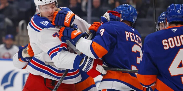New York Rangers center Matt Rempe (73) and New York Islanders defenseman Adam Pelech (3) fight during the second period when the New York Islanders played the New York Rangers Wednesday, January 28, 2026 at UBS Arena in Elmont, NY.