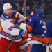 New York Rangers center Matt Rempe (73) and New York Islanders defenseman Adam Pelech (3) fight during the second period when the New York Islanders played the New York Rangers Wednesday, January 28, 2026 at UBS Arena in Elmont, NY.