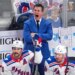 New York Rangers head coach Mike Sullivan yells instructions during a hockey game.