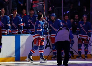 New York Rangers center Vincent Trocheck (16) is greeted by the fans as the New York Rangers honor him along with New York Rangers center J.T. Miller (8) and New York Rangers head coach Mike Sullivan after winning Olympic gold with Team USA in a pre game ceremony when the New York Rangers played the Philadelphia Flyers Thursday, February 26, 2026 at Madison Square Garden in Manhattan, NY.