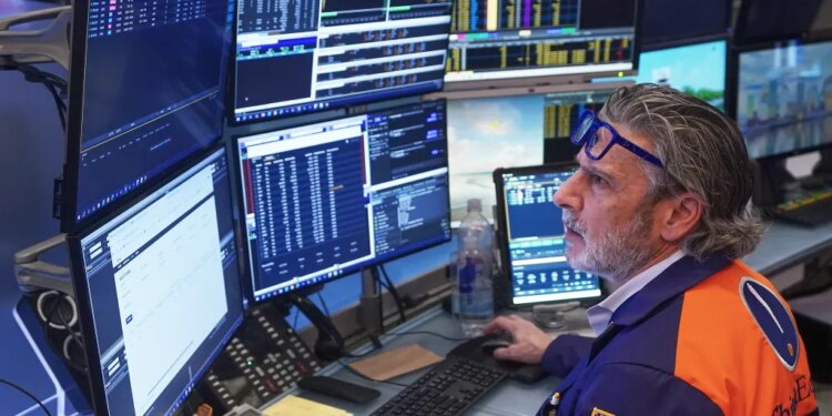 Trader John Romolo working on the floor of the New York Stock Exchange.