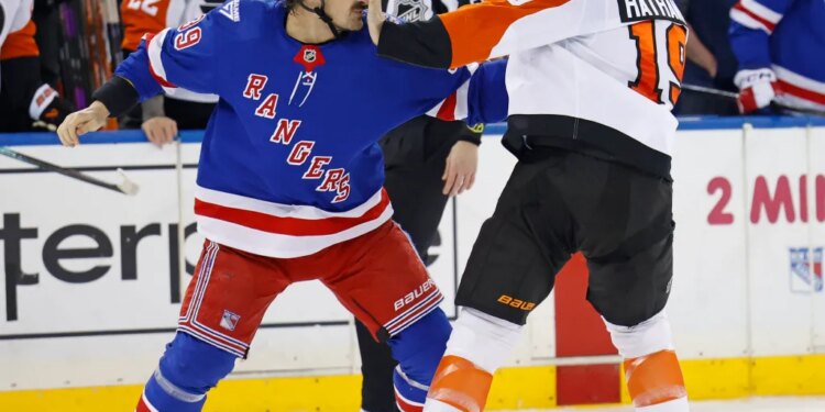 New York Rangers center Sam Carrick (39) and Philadelphia Flyers right wing Garnet Hathaway (19) scuffle during a game.