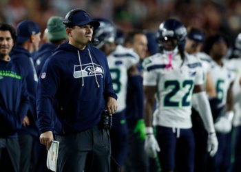 Seattle Seahawks head coach Mike MacDonald looking out during the game.