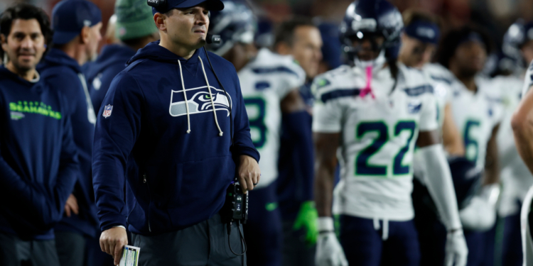 Seattle Seahawks head coach Mike MacDonald looking out during the game.