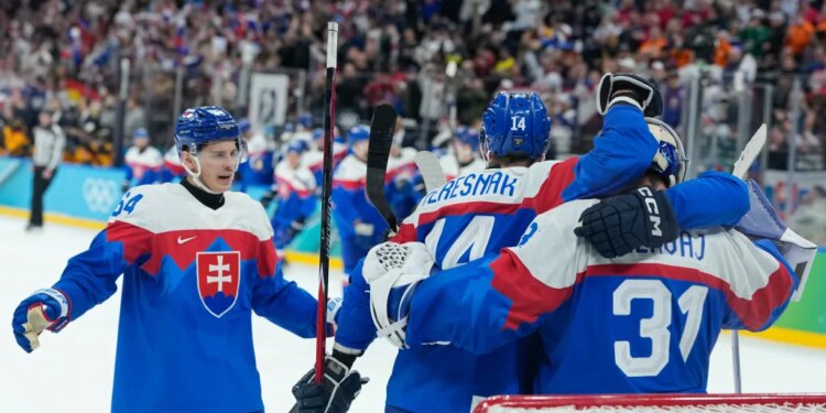 Slovakia players celebrate there victory after a men's ice hockey quarterfinal game between Slovakia and Germany at the 2026 Winter Olympics, in Milan, Italy, Wednesday, Feb. 18, 2026.