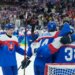Slovakia players celebrate there victory after a men's ice hockey quarterfinal game between Slovakia and Germany at the 2026 Winter Olympics, in Milan, Italy, Wednesday, Feb. 18, 2026.