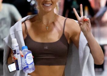 Sophie Cunningham smiling and making a peace sign as she arrives at the Barclays Center.