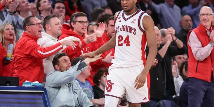 Zuby Ejiofor celebrates with Red Storm fans during St. John's win over Seton Hall on Jan. 20, 2026.