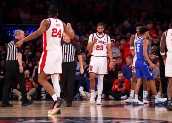 Bryce Hopkins and Zuby Ejiofor of the St. John's Red Storm basketball team celebrate during a game against the Creighton Bluejays.