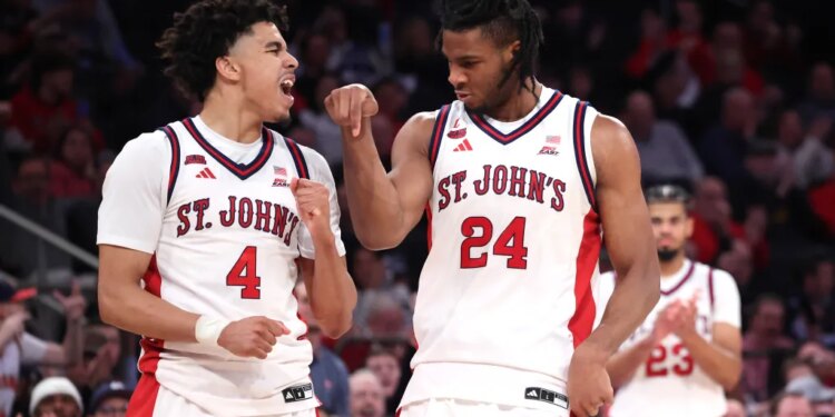 St. John's Red Storm forward Zuby Ejiofor #24 and guard Oziyah Sellers #4 celebrating during the second half of a game against the Butler Bulldogs.
