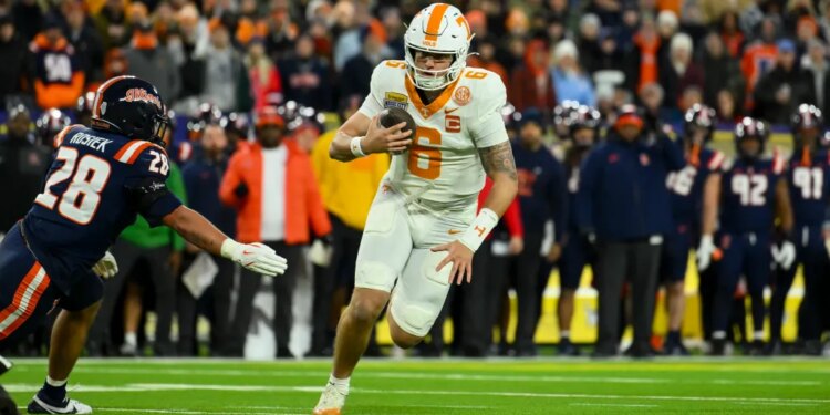 Tennessee Volunteers quarterback Joey Aguilar (6) runs the ball for a touchdown against the Illinois Fighting Illini during the first half at Nissan Stadium.