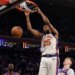 New York Knicks guard Mikal Bridges dunking the ball during a game against the Los Angeles Lakers.
