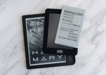 The Xteink X4 e-reader on top of two smaller Kobo e-readers.