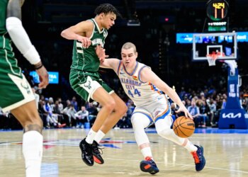 Oklahoma City Thunder guard Nikola Topić drives against Milwaukee Bucks forward Ousmane Dieng.