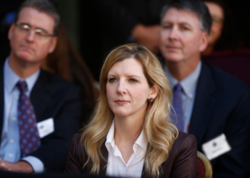 Kathryn Ruemmler listening at an FBI event.