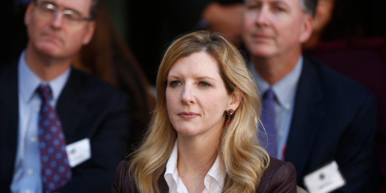 Kathryn Ruemmler listening at an FBI event.