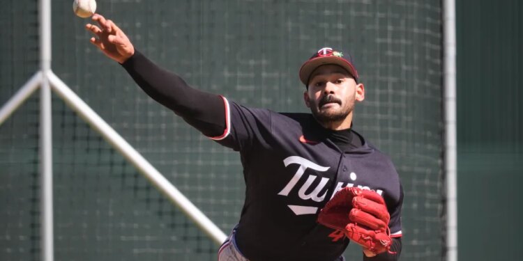 Minnesota Twins pitcher Pablo Lopez throws during a spring training baseball workout.