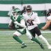 New York Jets quarterback Tyrod Taylor (2) runs the ball as Atlanta Falcons defensive end Leonard Floyd (56) gives chase during the first half when the New York Jets played the Atlanta Falcons Sunday, November 30, 2025 at MetLife Stadium in East Rutherford, NJ.