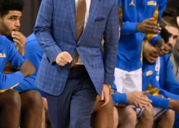 UCLA head coach Mick Cronin yelling at players from the sideline during a game against the Illinois Fighting Illini.