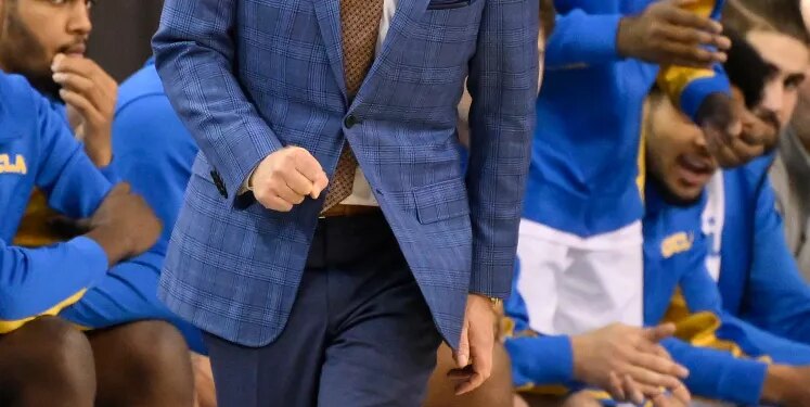 UCLA head coach Mick Cronin yelling at players from the sideline during a game against the Illinois Fighting Illini.