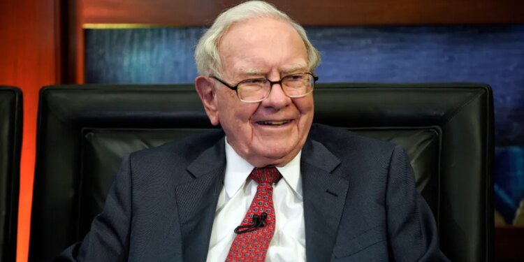 Warren Buffett smiles during an interview.