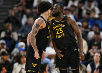 Draymond Green celebrates with Warriors teammate Gui Santos.