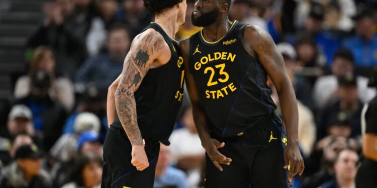 Draymond Green celebrates with Warriors teammate Gui Santos.