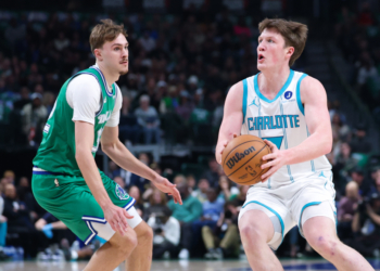 Charlotte Hornets guard Kon Knueppel (7) shoots as Dallas Mavericks forward Cooper Flagg (32) defends.