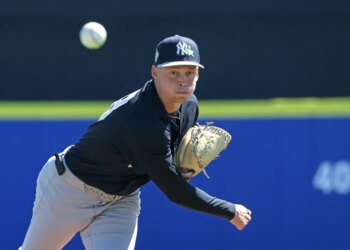 New York Yankees pitcher Will Warren #98, throwing a warmup pitch at the start of the 1st inning.