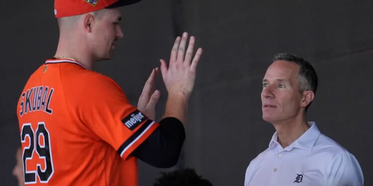 Detroit Tigers owner Chris Ilitch speaks with pitcher Tarik Skubal during spring training workouts.