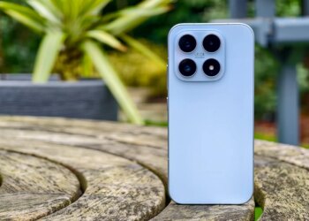 Photo of blue Xiaomi 17 on a wooden table outdoors