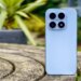 Photo of blue Xiaomi 17 on a wooden table outdoors