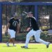 New York Yankees right fielder Aaron Judge catches a ball in front of center fielder Trent Grisham during spring training.