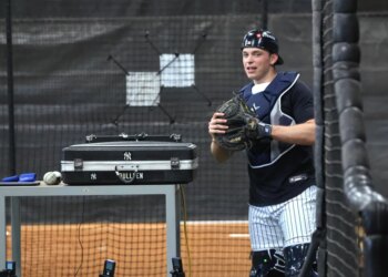 New York Yankees catcher Ben Rice #22 in the bullpen.