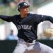 New York Yankees pitcher Carlos Lagrange (84) throws a pitch against the Minnesota Twins during spring training.