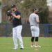 New York Yankees pitchers Gerrit Cole and Carlos Rodón throwing on a back field at Steinbrenner Field.