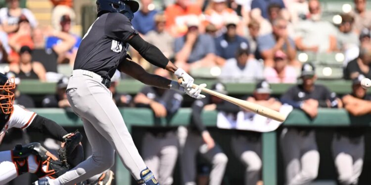 New York Yankees second baseman Jazz Chisholm Jr. (13) hits a single.