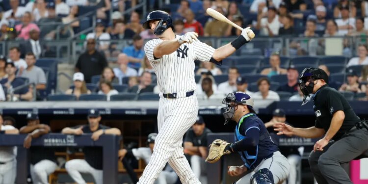 New York Yankees first base Paul Goldschmidt striking out swinging during a baseball game.