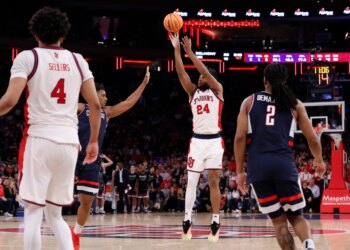 St. John's Red Storm forward Zuby Ejiofor (24) shoots a three-point shot.
