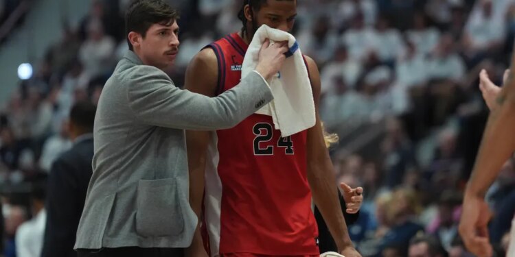 Zuby Ejiofor, exiting the court after sufffering a bloody lip, struggled in St. John's  72-40 blowout road loss to UConn on eb. 25, 2026.
