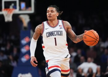 UConn's Solo Ball (1) looks to pass during an NCAA college basketball game against Xavier.