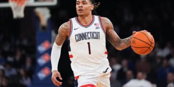 UConn's Solo Ball (1) looks to pass during an NCAA college basketball game against Xavier.