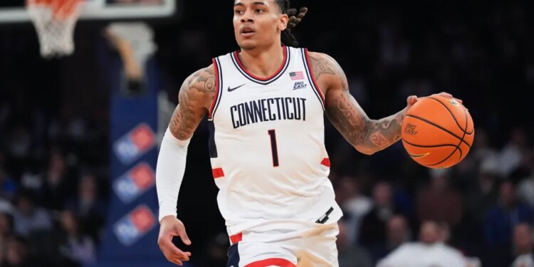 UConn's Solo Ball (1) looks to pass during an NCAA college basketball game against Xavier.