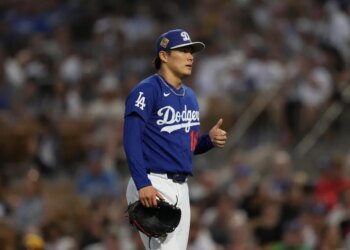 Yoshinobu Yamamoto, a pitcher for the Los Angeles Dodgers, gives a thumbs up.